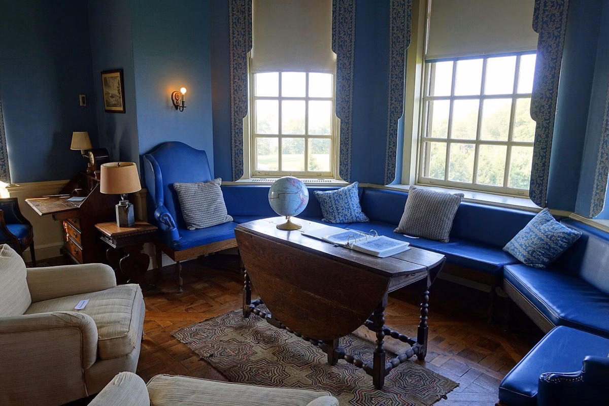 The Blue Bedroom in the Great House, with blue walls and window seats