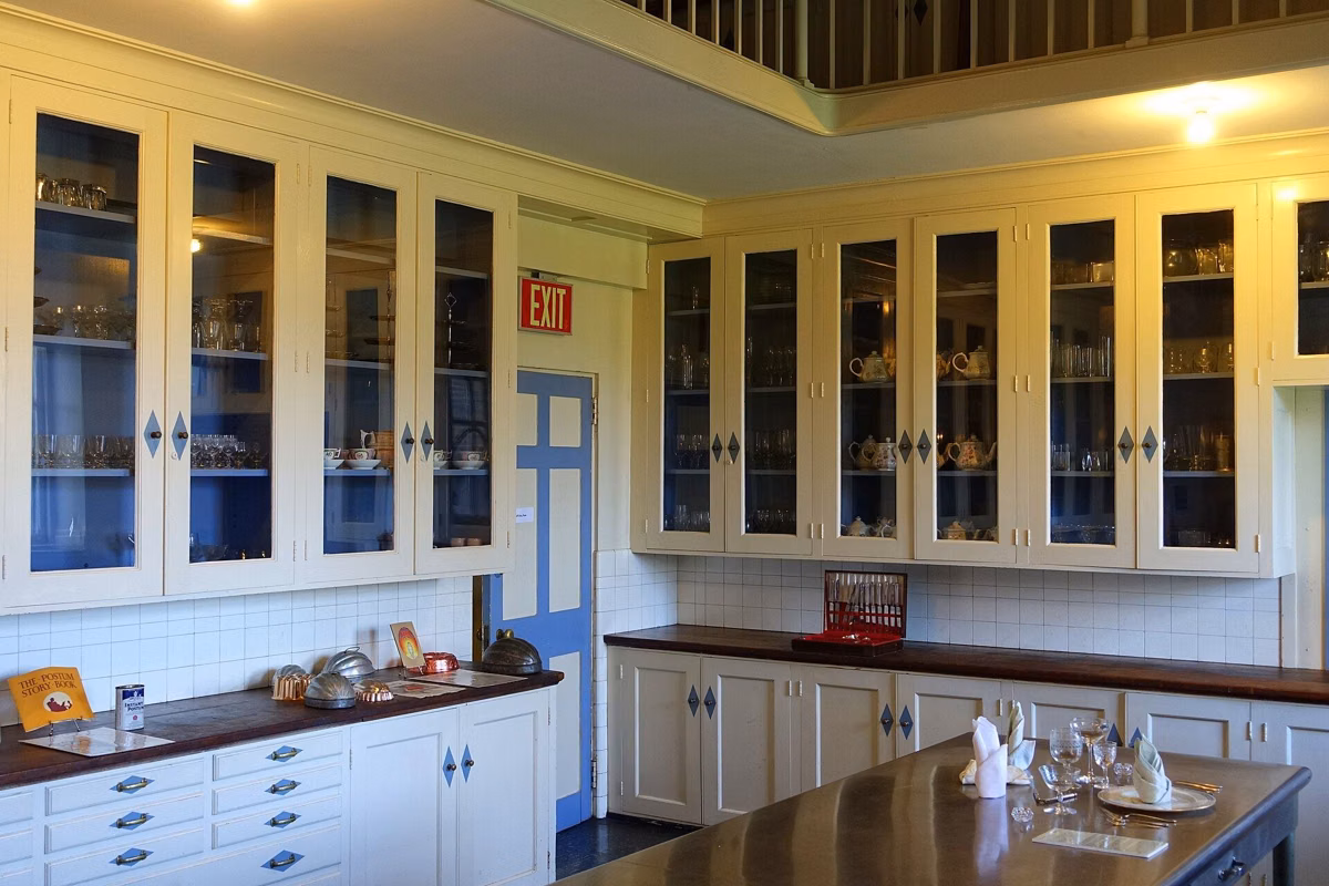 The serving pantry in the Great House, with glass-front cabinets