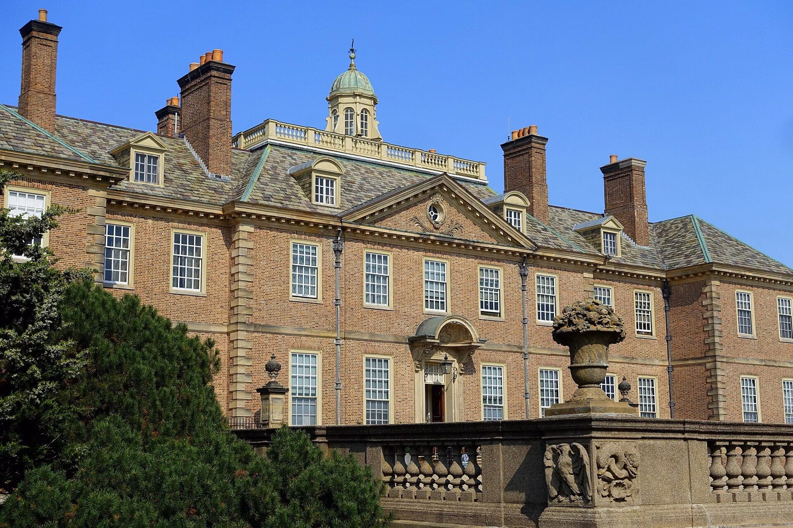 The Great House at Castle Hill seen from the terrace side, with urns and balustrades